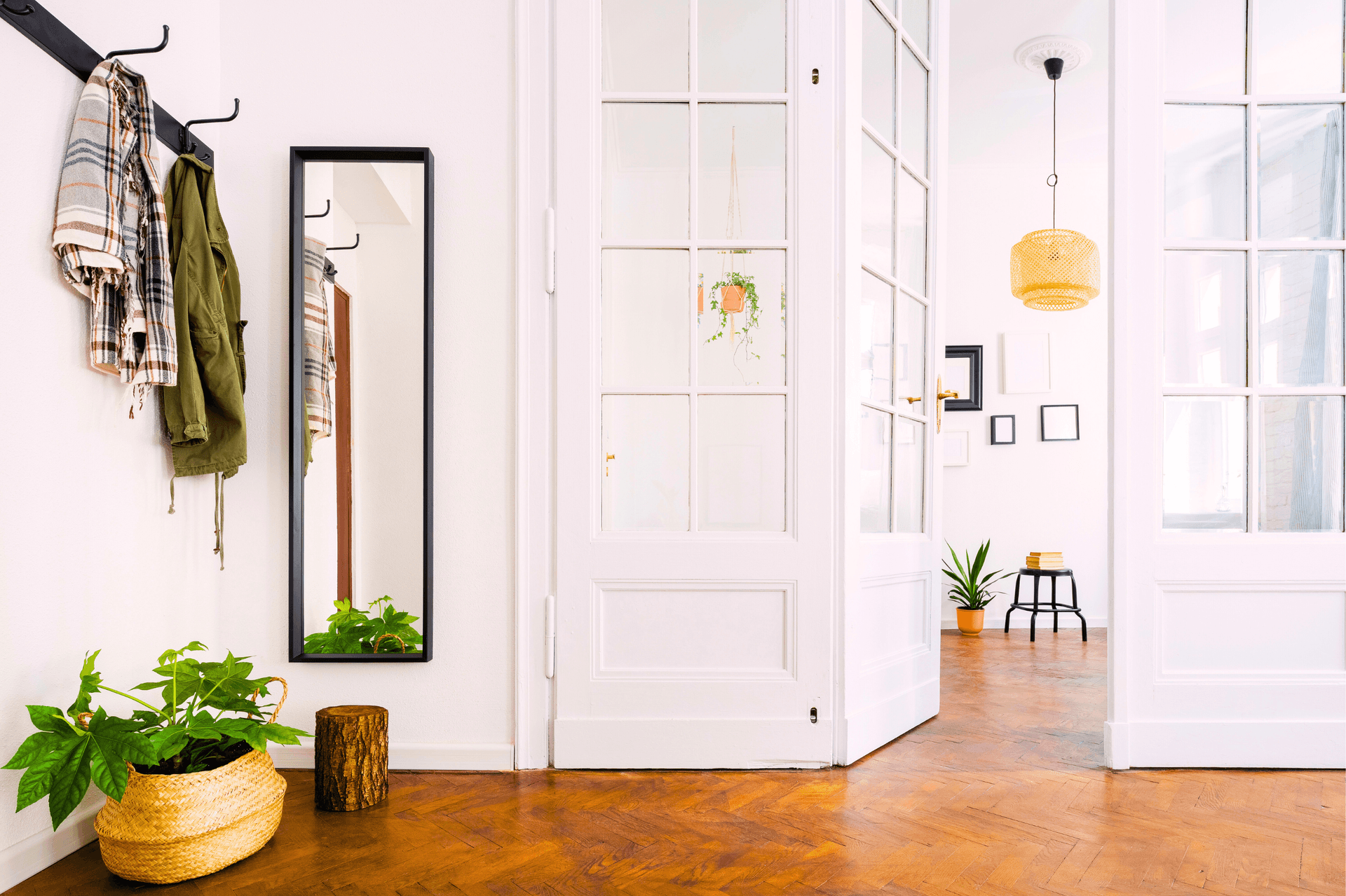 interior home with wood floors, interior door leading from foyer to living room
