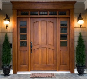 Close up of gorgeous wood front door with decorative windows around it